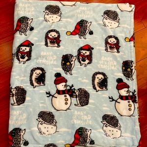 Cute holiday hedgehog blanket perfect for cozy nights and lounging around